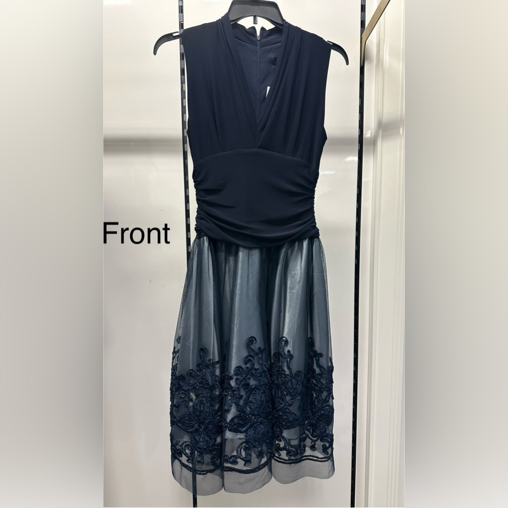 Brand new Beautiful Cocktail Dress in navy with Tulle and navy flowers. Size 12